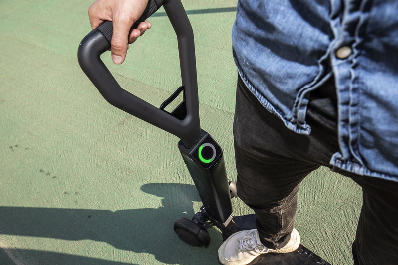 The handlebar is designed to make the scooter steerable with one hand